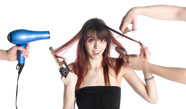 Hairstylists Styling the Hair of a Young Woman