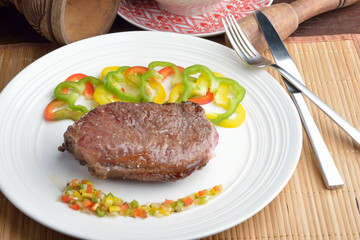 .steak with vinaigrette: sweet pepper, onion and tomato