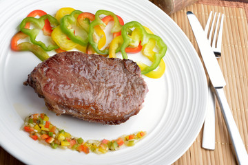 .steak with vinaigrette: sweet pepper, onion and tomato