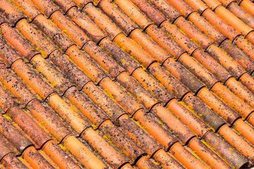 Old and dirty red roof tiles