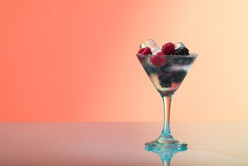 raspberry and blackberry cocktail with ice, studio shot