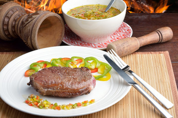 .steak with vinaigrette: sweet pepper, onion and tomato