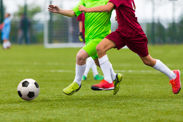 Football soccer match. Boys playing soccer game