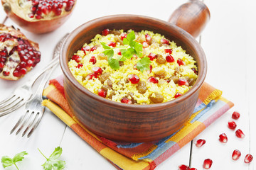 Couscous with pomegranate, raisins and spices