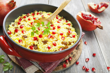 Couscous with pomegranate, raisins and spices