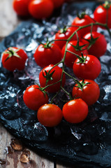 Sweet fresh tomatoes on the wooden table