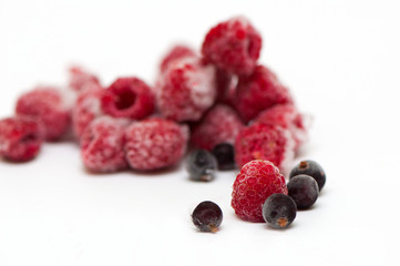 Frozen raspberries on white