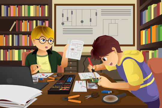Two kids working on an electronic project
