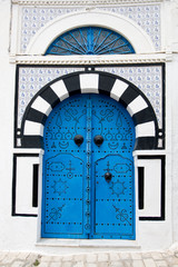 Blue doors and white wall of building in Sidi Bou Said, Tunisia