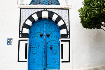 Blue doors and white wall of building in Sidi Bou Said, Tunisia