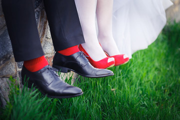 groom. bride, wedding shoes, red
