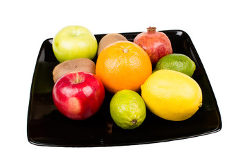 Fruit plate with oranges, apples, lemon