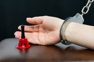Chained arm with ring for sex bell in front