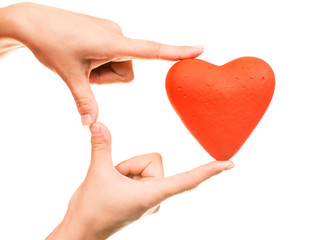 Red heart in man hands, isolated on white
