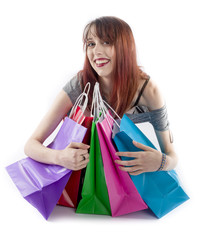 Young Woman Hugging Colorful Shopping Bags