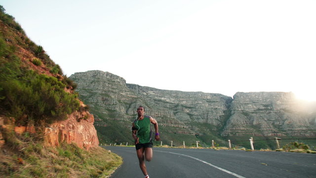 Fit athlete looking determined and focused as he exercises