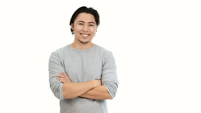 Healthy young man standing on white background feeling great