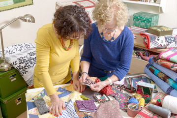 two women working on their patchwork - obrazy, fototapety, plakaty