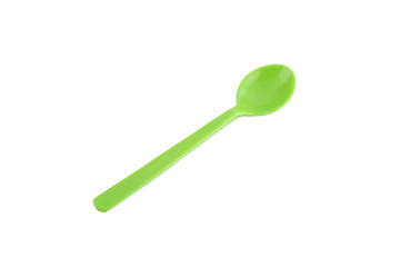 Green plastic spoon isolated on white.