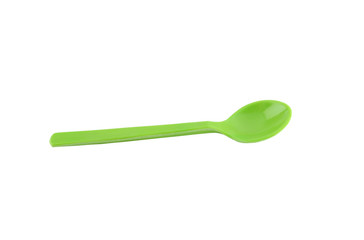 Green plastic spoon isolated on white.