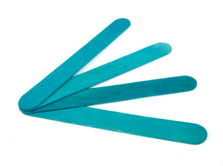 Six popsicle bluish sticks for arts and crafts on a white