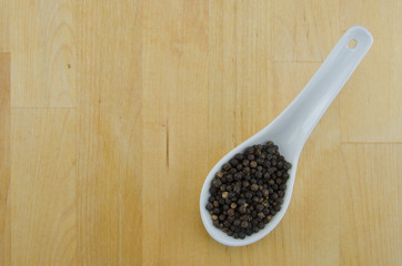 Peppercorns in Spoon with Copy Space