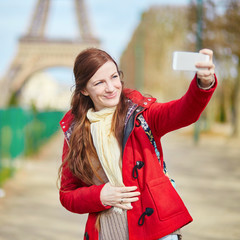 Fototapeta premium Young tourist in Paris doing selfie