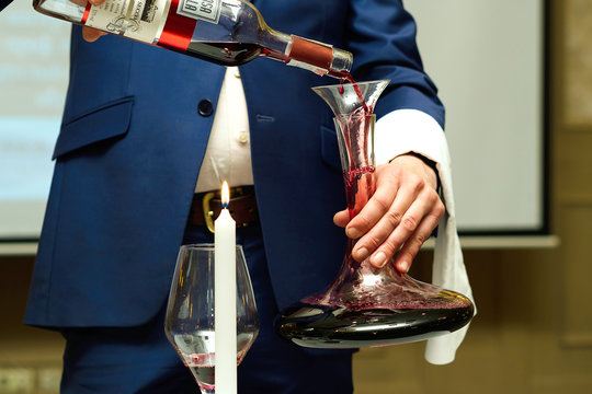 Sommelier Pouring Wine To Glass