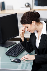 businesswoman feeling stressed out at work