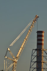 Power plant. Crane at a construction site. Chimney and smoke