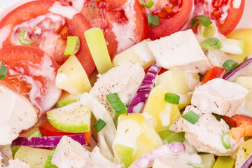 Warm meat salad with vegetables.