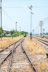 Fototapeta na wymiar Vacant Rail way switch track with yellow die grass