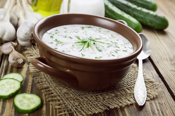 Summer soup with cucumbers, yogurt and fresh herbs