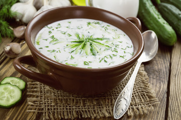 Summer soup with cucumbers, yogurt and fresh herbs