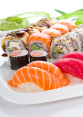 Sushi set on white plate over white background
