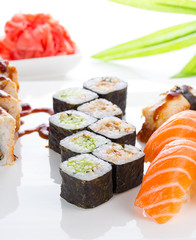 Sushi set on white plate over white background