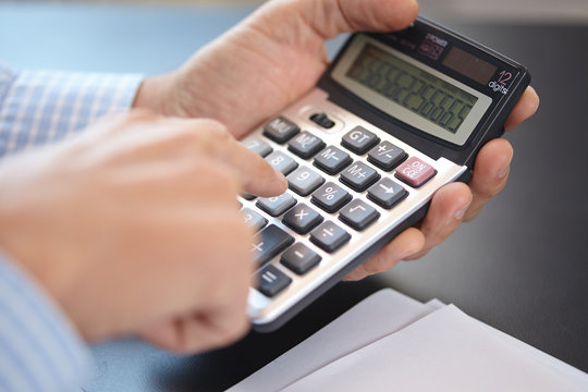 businessman with calculator