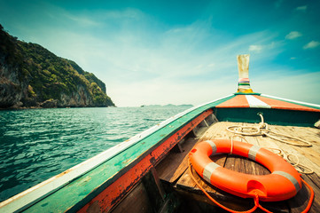 buoy and wooden boat in the sea, travel in Thailand