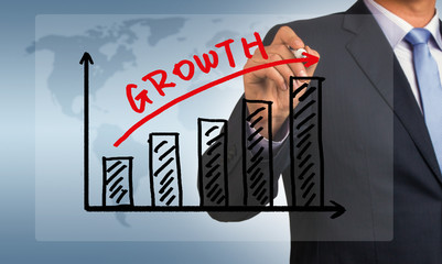 growth graph hand drawing by businessman