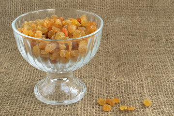 dried grapes in a glass vase