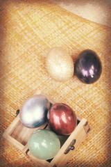 Vintage paper texture, Colorful easter eggs in wood box on bambo