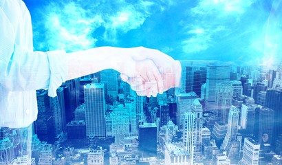 Composite image of close up of a business people closing a deal