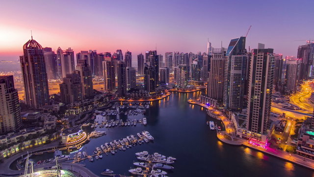 Dubai marina harbor panorama from night to day transition