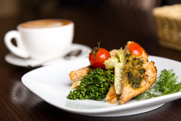 breakfast sandwich and coffee on wooden background