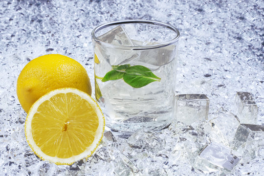 Closeup of drink with citrus fruit and ice - Stock Image