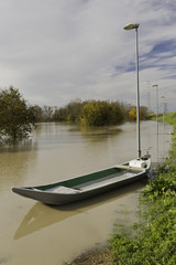 The Po is in flood A boat is secured to a lamppost