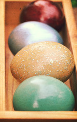 Colorful easter eggs in wooden box(Shallow dof)