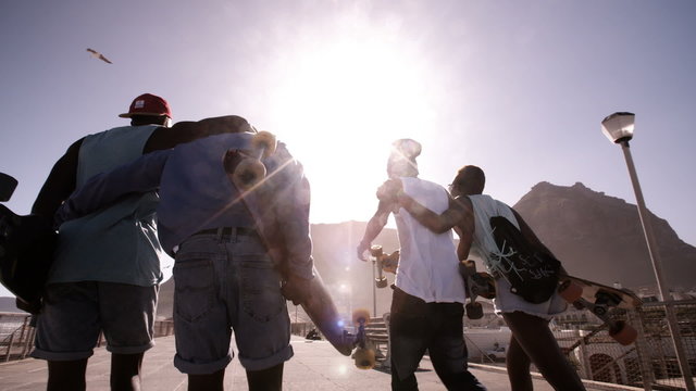 Group of cool teenage friends walking together