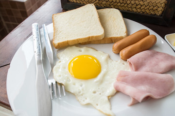 English breakfast with fried eggs, bacon, sausages,