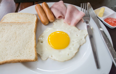English breakfast with fried eggs, bacon, sausages,